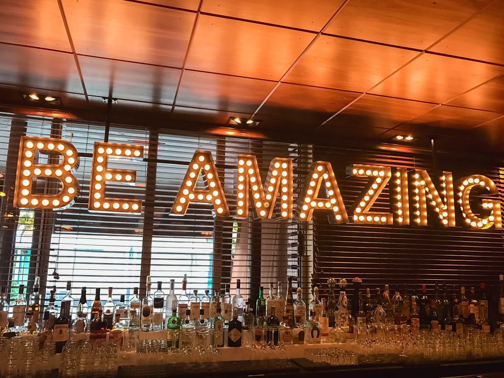 a bar with a large sign that says be amazing.