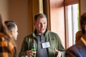 A group of people talking at a business event.