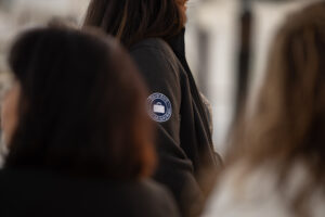 A group of women are standing in a line.