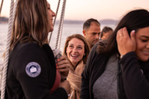 A group of people on a boat laughing.