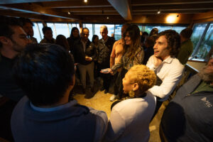 A group of people standing around a table.