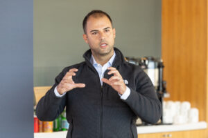 A man giving a presentation in front of a group of people.
