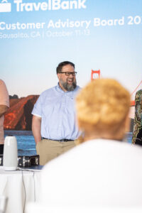 A group of people standing in front of a stage.