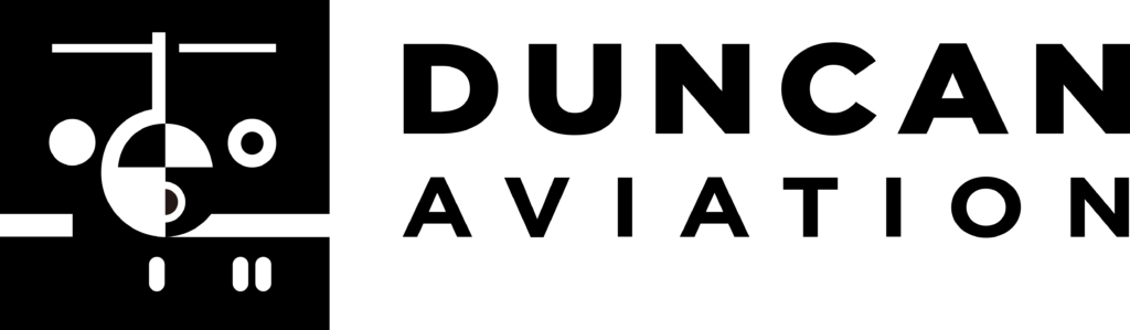 Black and white abstract design with geometric shapes resembling eyes and a mouth on the left, and solid black on the right.