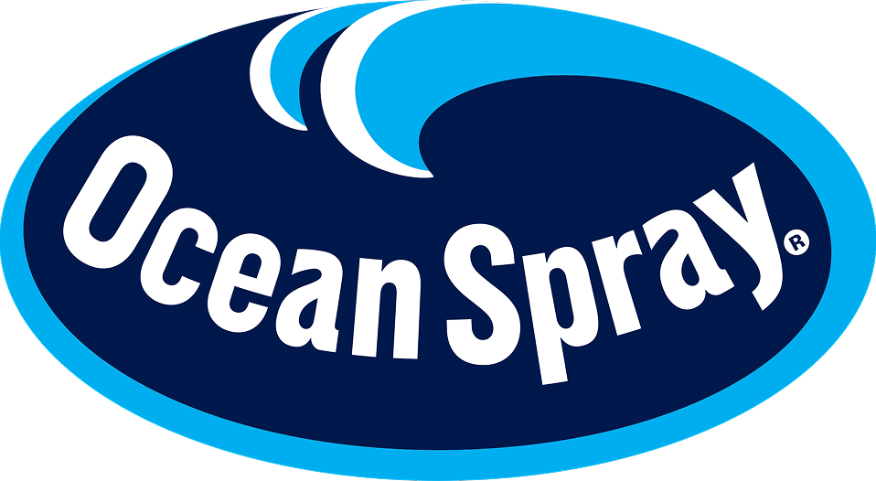 Ocean Spray logo featuring white text on a navy blue oval background with a light blue outline and two white wave graphics above the text.
