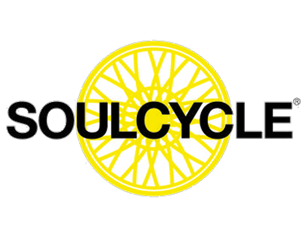 SoulCycle logo with the word "SOULCYCLE" in black text over a yellow bicycle wheel graphic on a transparent background.